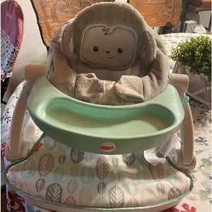 Fisher Price baby seat. Only used few times. Use on floor,chair,and table.